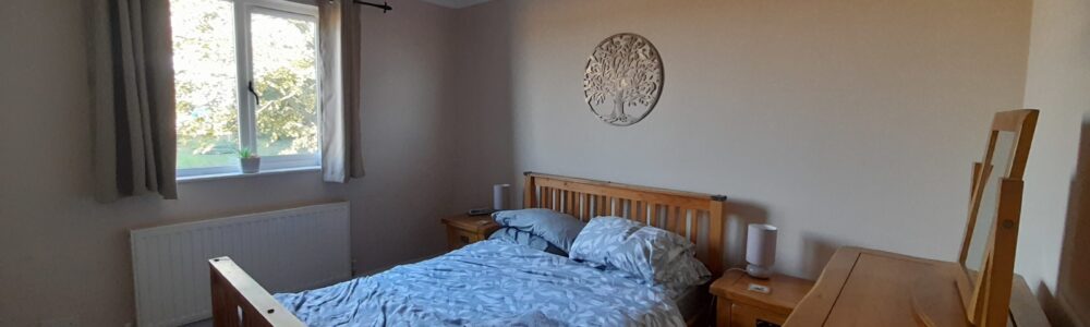20231017_154826 First floor double bedroom with built-in wardrobe, chest of drawers and two bedside units with lamps, at The East Wing Rufford Park Lodge