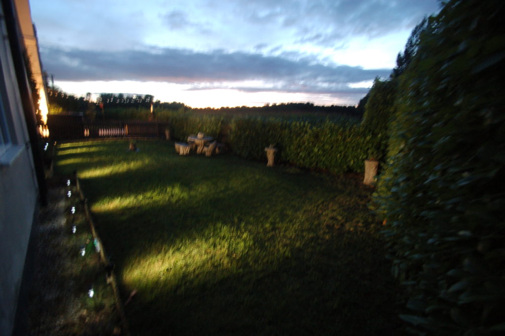 Rear garden illuminated at night, with views over Deer Park to the edge of Sherwood Forest, at The East Wing Rufford Park Lodge