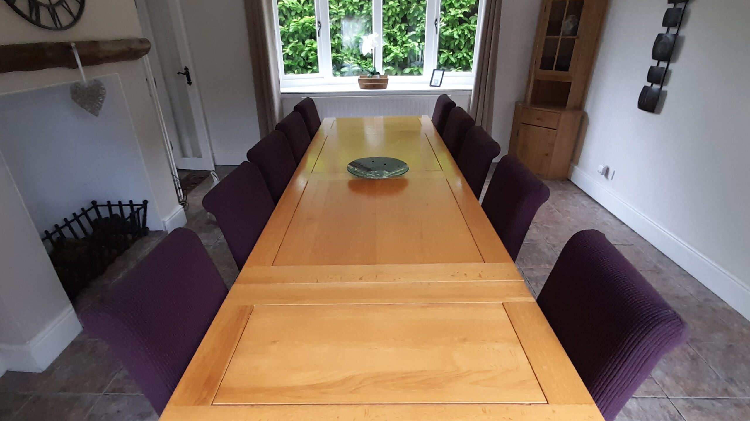 Large dining room with extendable table and ten seats.