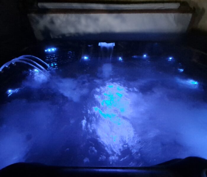 Hot Tub with blue light selected from 8 presets including Rainbow sequence, at Rufford Park Lodge.